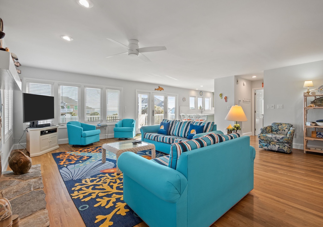 Unwind in your bright coastal living room with ocean-themed decor and comfortable seating for your perfect beach getaway.