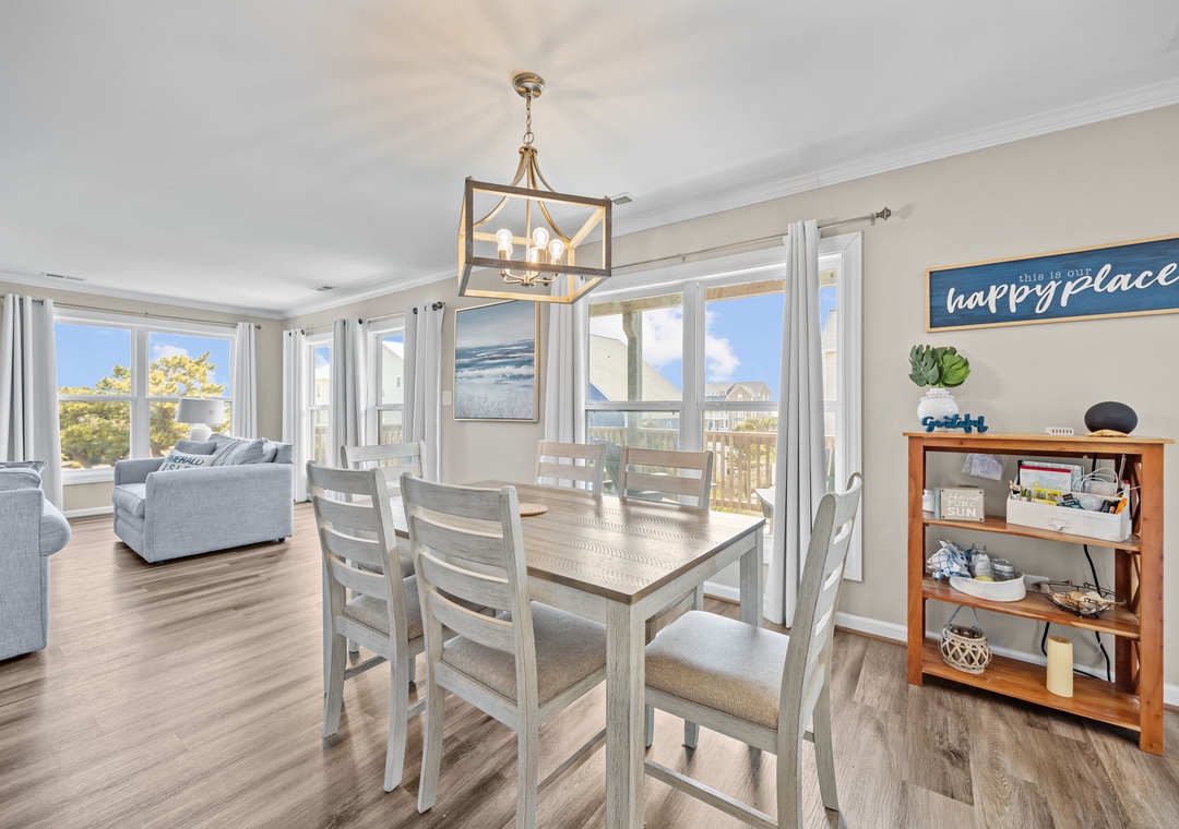 Gather around your spacious dining table for memorable meals while enjoying panoramic views through floor-to-ceiling windows.