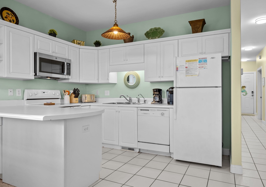 Your fully equipped kitchen awaits with everything you need to whip up delicious vacation meals in this bright, welcoming space.