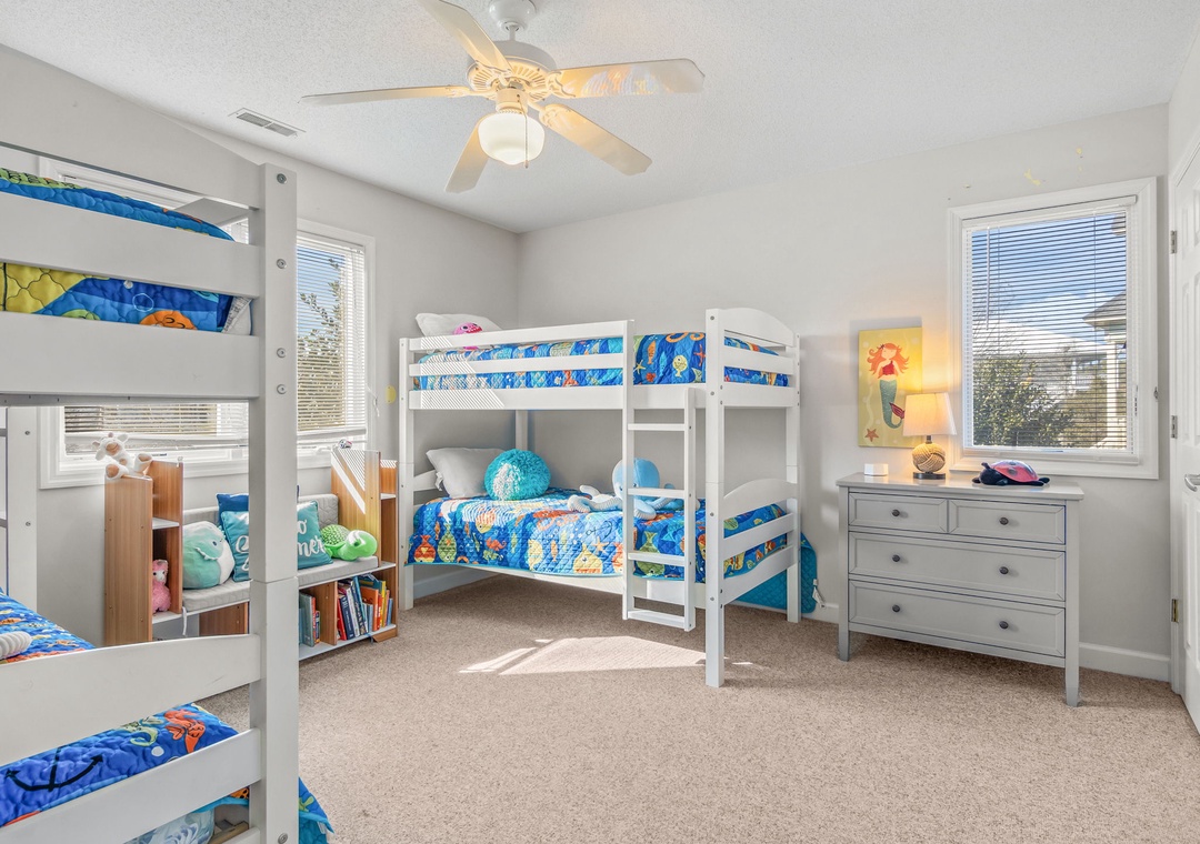 Your little adventurers will love this bright bedroom with two sets of bunk beds, perfect for family stays and creating magical childhood memories together.