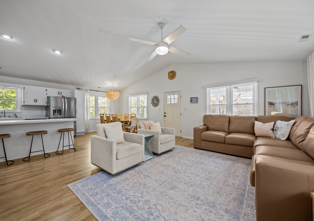 Unwind in this bright, open living space where soft leather seating and modern kitchen create the perfect backdrop for memorable gatherings.