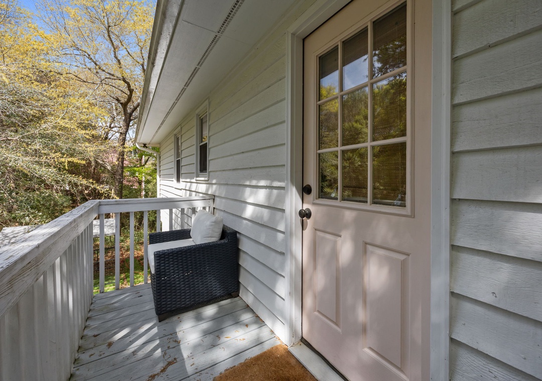 Step onto your private entrance deck surrounded by beautiful autumn foliage and natural light streaming through classic windows.
