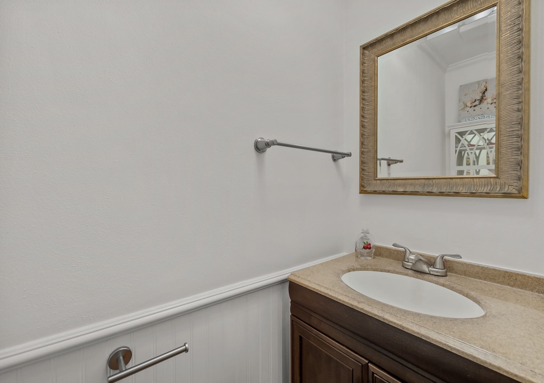 Your private powder room features thoughtful details like grab bars for safety and a convenient vanity area.