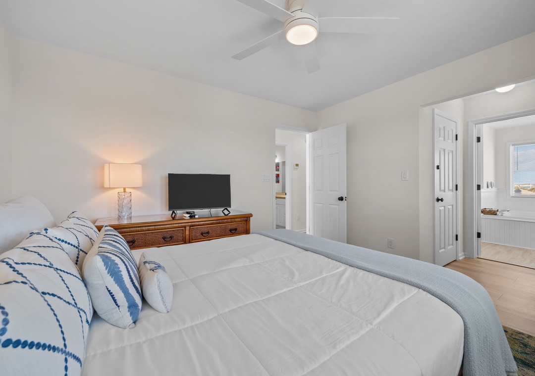 Rest peacefully in your serene bedroom with crisp linens, gentle lighting, and thoughtful coastal touches.