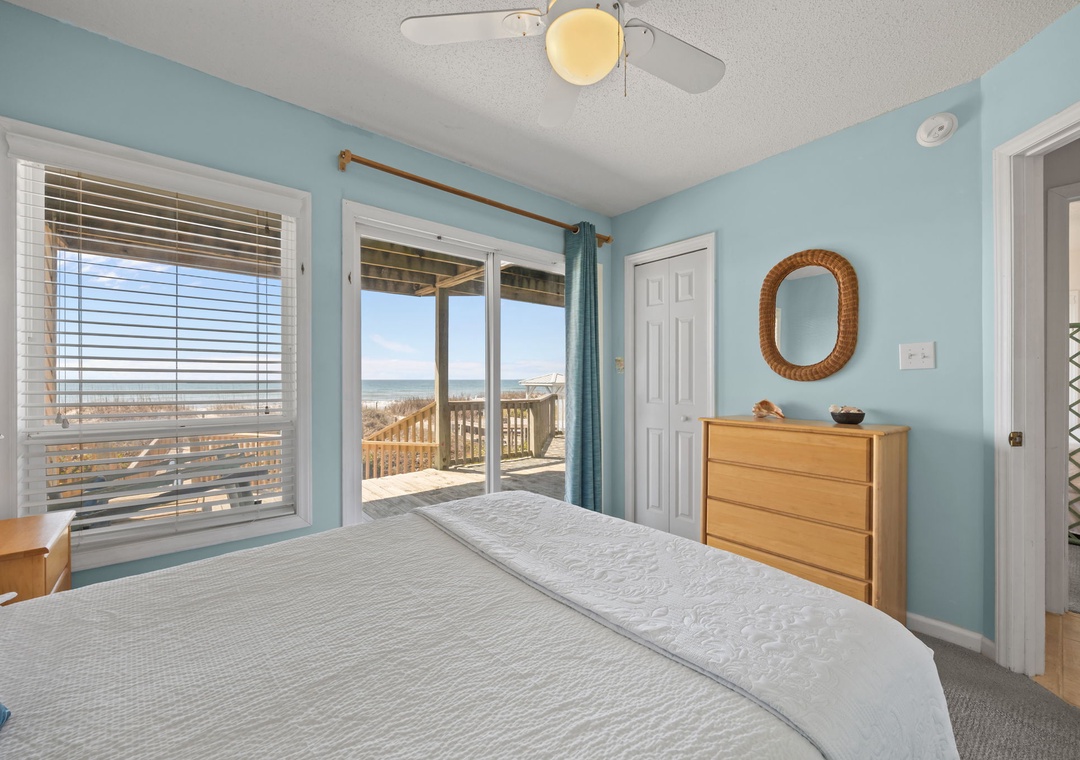 Wake up to stunning ocean views from your serene bedroom with direct beach access. Drift to sleep with sea breezes flowing through sliding doors.