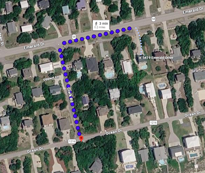 Aerial view showing the property's location within a peaceful residential neighborhood surrounded by mature trees and nearby homes.