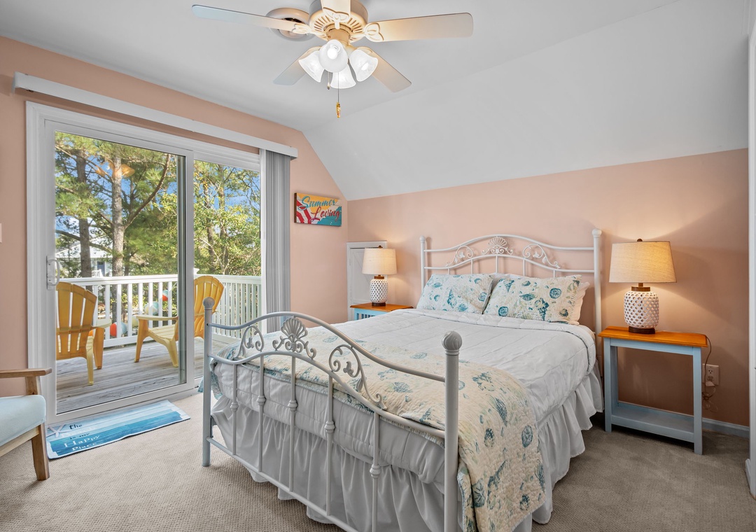 Wake refreshed in your peaceful bedroom with soft ocean-themed linens and step onto your private balcony for morning tree views.
