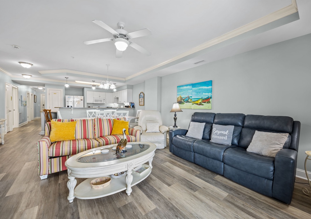 Relax in your bright living space with colorful coastal charm, modern comforts, and an open layout perfect for gathering together.