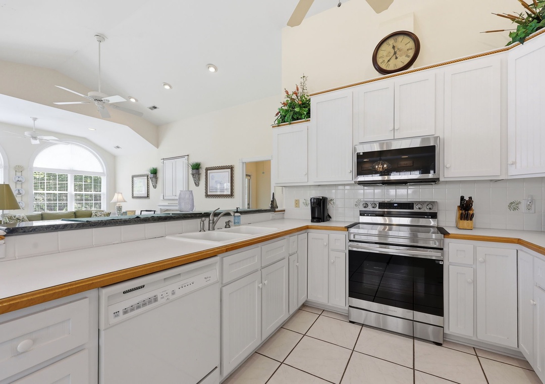 Step into your fully-equipped kitchen with ample counter space, modern appliances, and bright natural light—perfect for preparing your favorite meals during your stay.