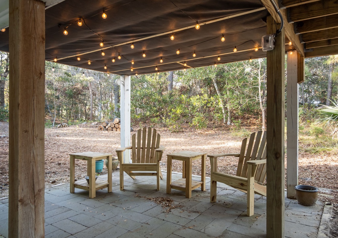 Unwind in your private covered patio where twinkling string lights create the perfect ambiance for evening conversations and peaceful mornings.