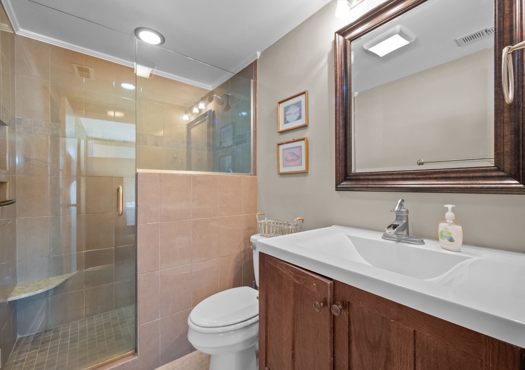 Refresh in your private bathroom with walk-in shower and elegant fixtures.