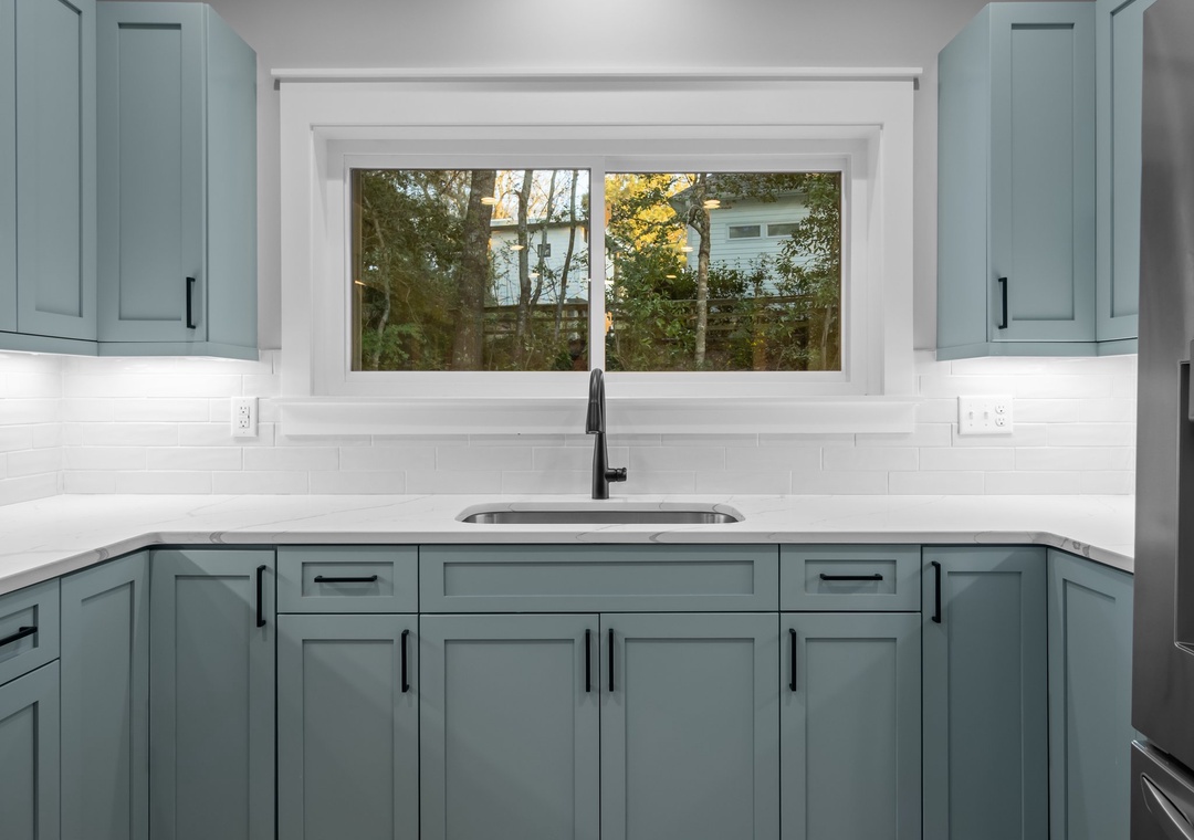 2nd Kitchen in game room with window that opens to the pool bar with seating!