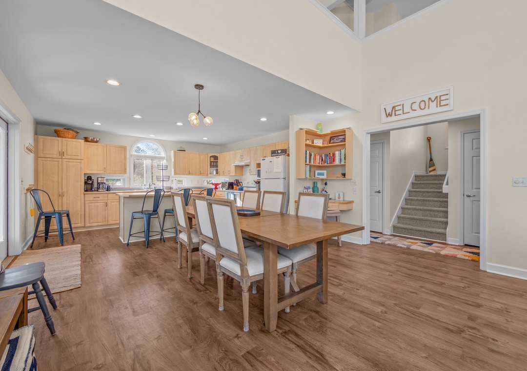 Gather around this spacious dining table where you'll share meals and create memories in your open-concept kitchen and dining area.