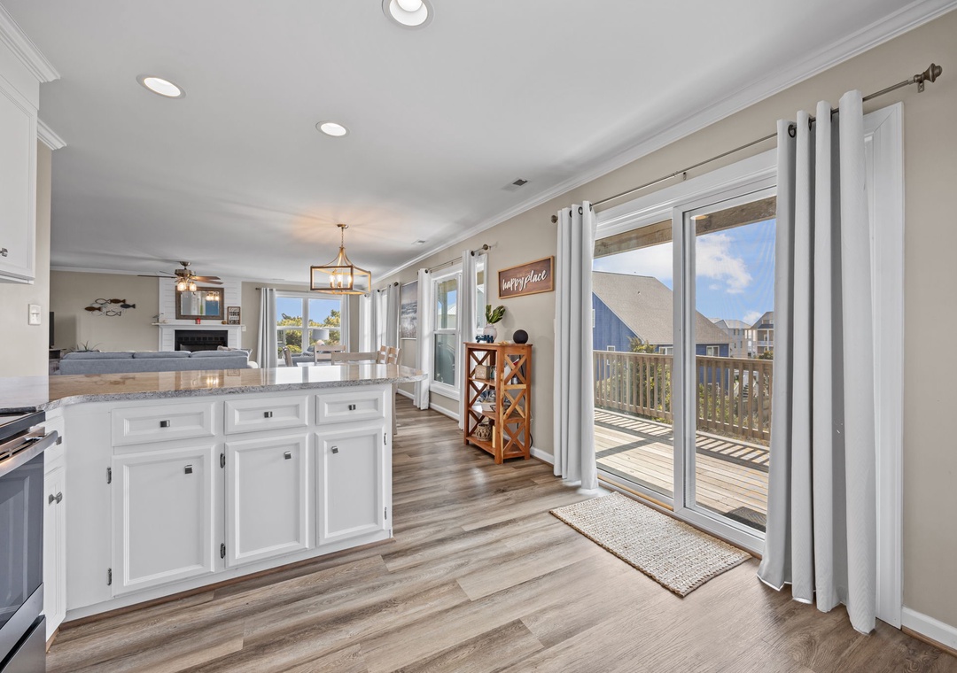 Your bright, airy kitchen flows seamlessly to a private deck where you'll savor morning coffee with stunning views.