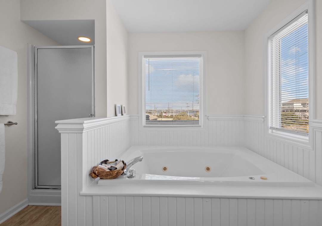 Sink into the spacious jetted tub and let warm bubbles melt your stress away while you gaze out at peaceful views.