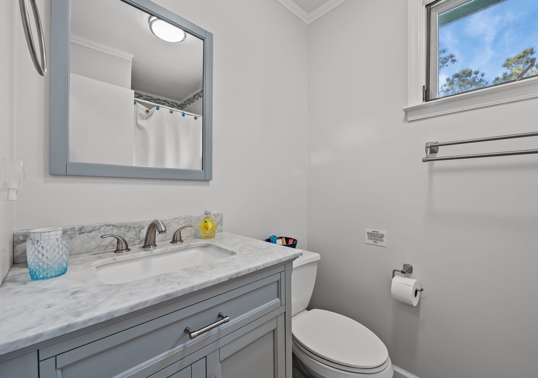 Refresh in your beautifully appointed bathroom with elegant marble countertops and thoughtful amenities.