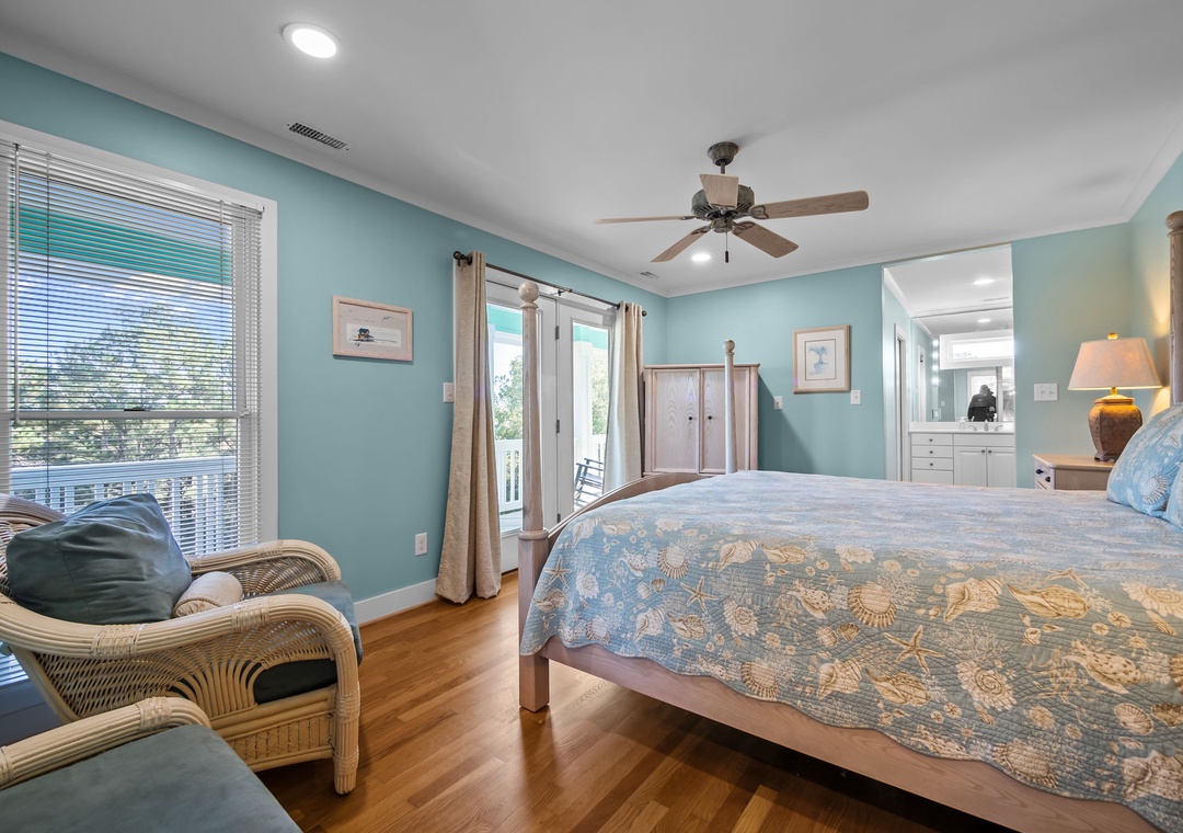 Unwind in your tranquil bedroom sanctuary with soothing ocean colors, warm hardwood floors, and French doors opening to your private balcony.