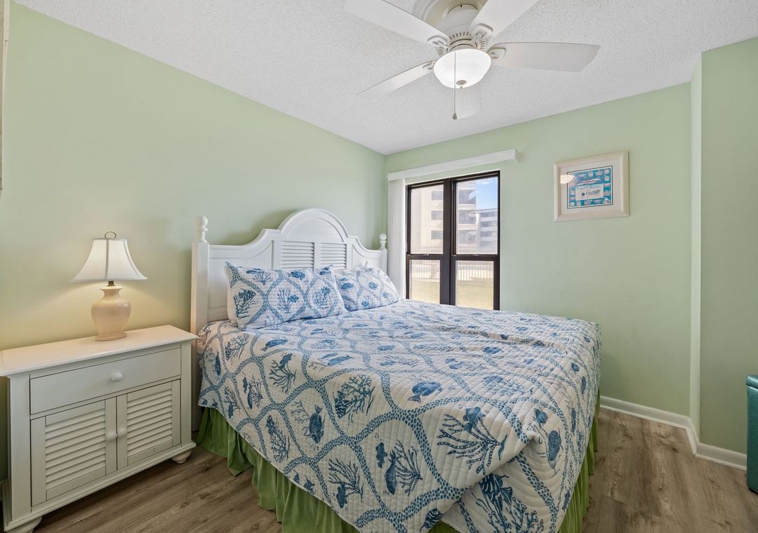 Drift into peaceful dreams surrounded by soothing mint walls and ocean-inspired bedding that perfectly captures the coastal spirit.
