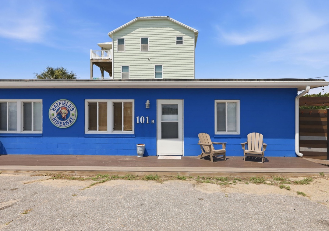 A charming beachfront rental with a welcoming front deck, two Adirondack chairs, and direct access to sandy shores. The property includes convenient parking right at your doorstep.