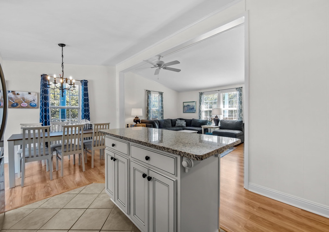Your open-concept kitchen flows seamlessly into the dining and living areas, perfect for gathering with loved ones over home-cooked meals.