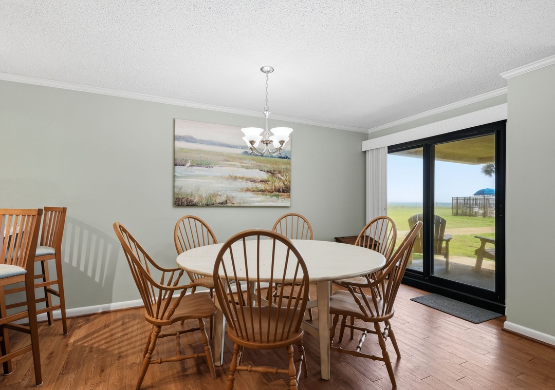Gather around the table for meals with loved ones, bathed in natural light from the sliding doors that open to your private outdoor space and scenic views beyond.