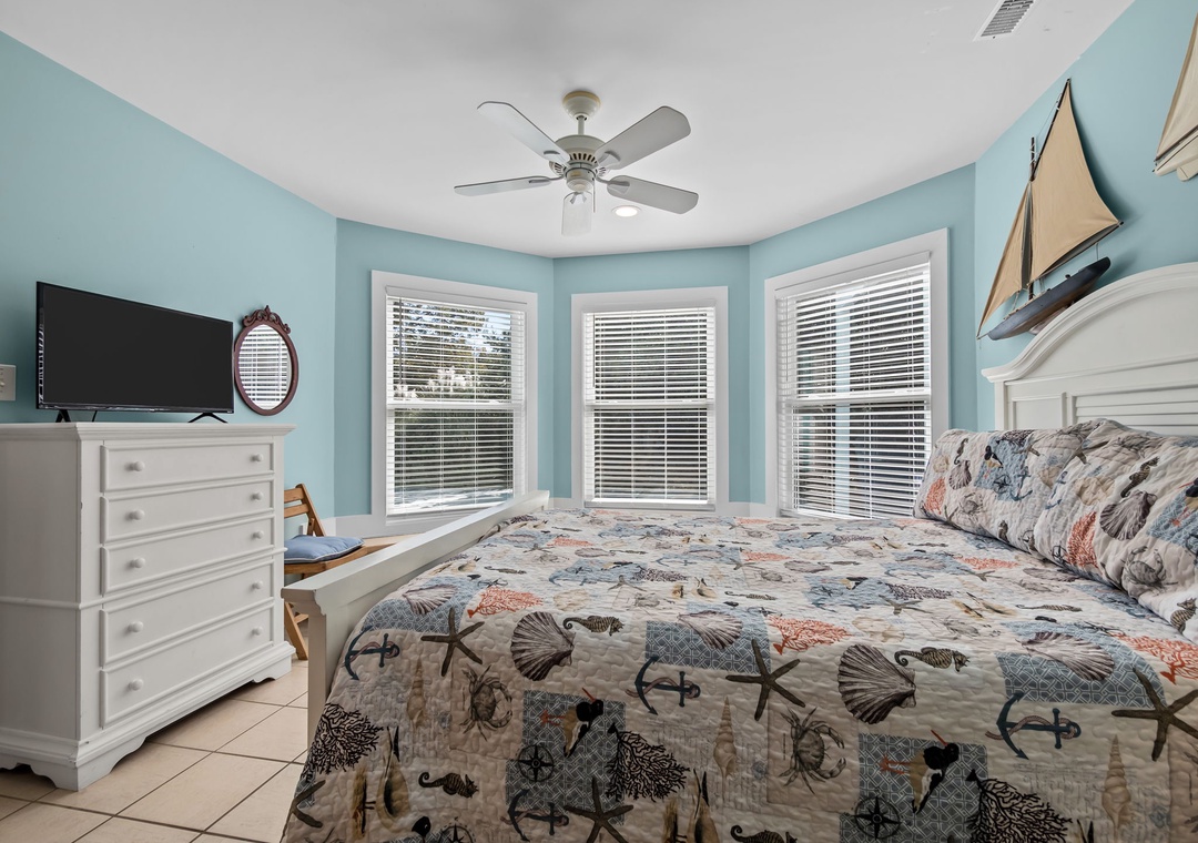 Drift to sleep in your coastal-themed bedroom with soothing ocean colors and charming nautical bedding.