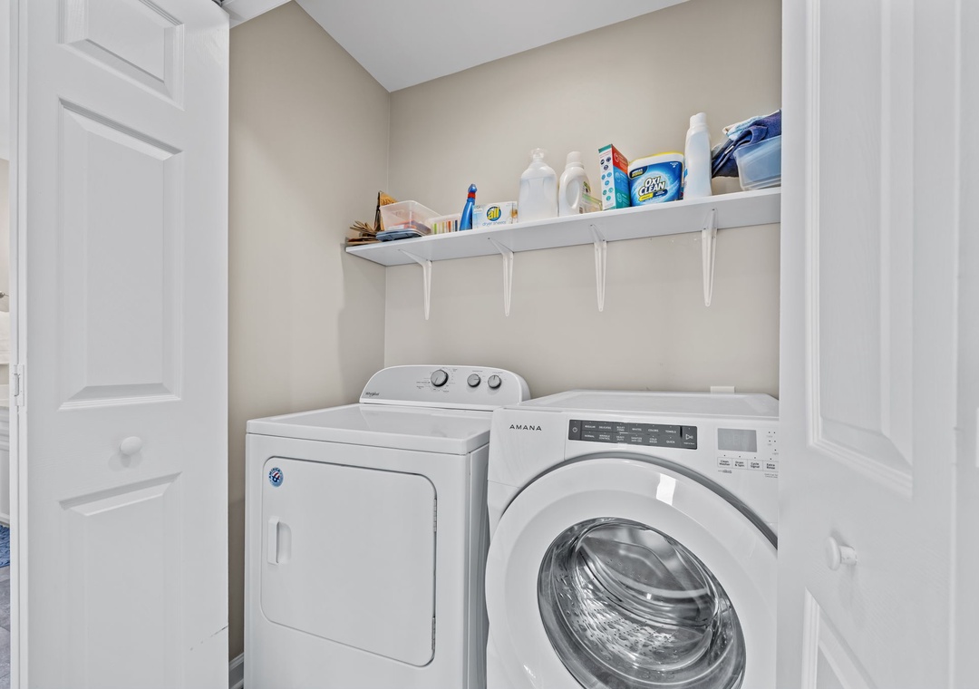 Your dedicated laundry room keeps everything organized with full-size washer and dryer plus convenient shelving for supplies.
