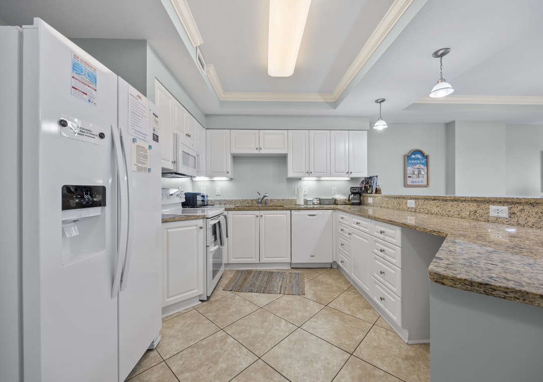 Your fully equipped kitchen awaits with granite counters, modern appliances, and everything you need to create memorable meals together.