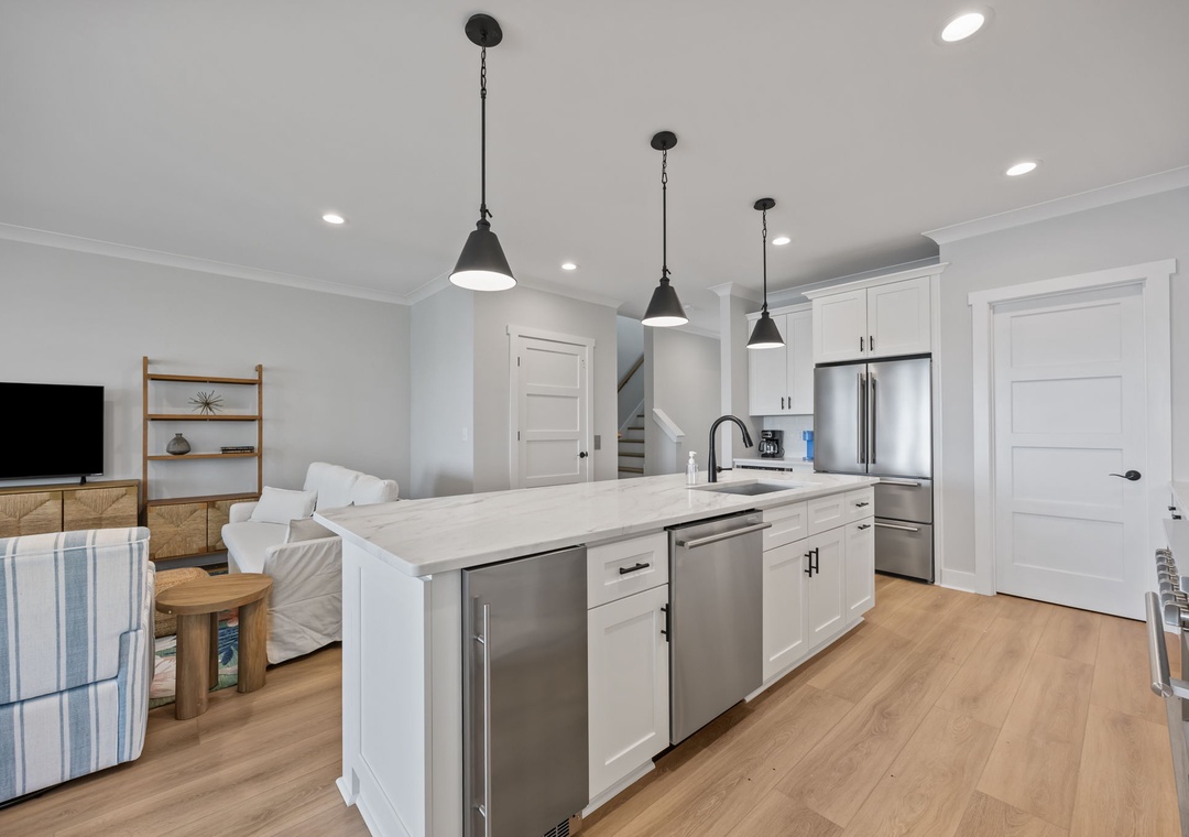 Your open-plan kitchen flows seamlessly into the living area, creating the perfect space for cooking and connecting with loved ones.