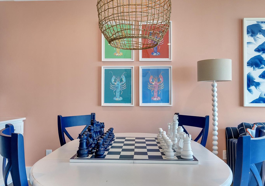 Gather around the dining table for game night or meals with loved ones. The coastal-inspired décor and natural light create a warm, inviting space where memories are made.