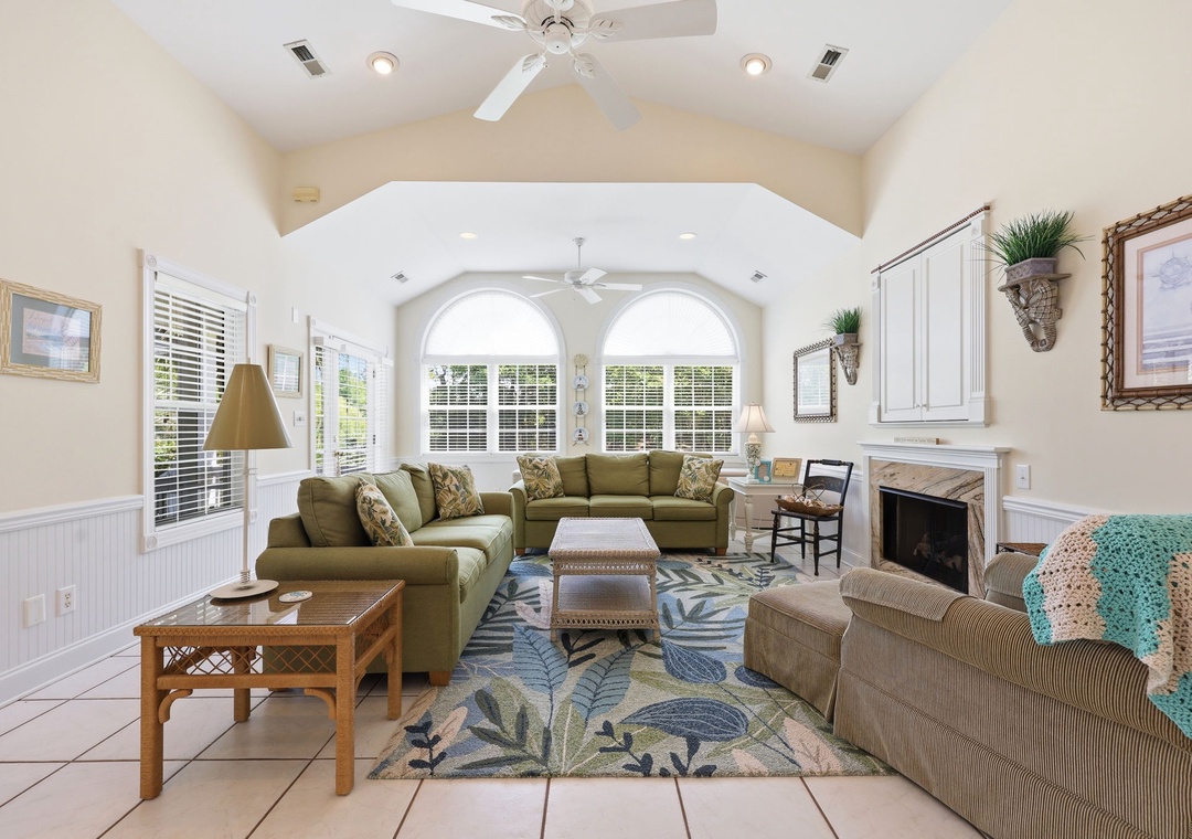 Settle into your spacious living area with vaulted ceilings, cozy sofas, and a fireplace—perfect for unwinding after a day exploring the area.