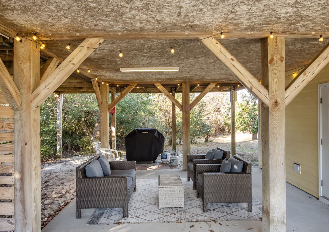 Relax under your private pavilion with comfortable seating and warm string lights creating the perfect ambiance for evening conversations.