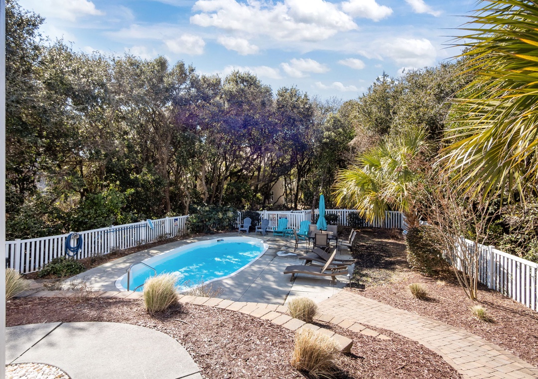 Your private pool oasis awaits, surrounded by tropical palms and perfect for afternoon swims under sunny skies.