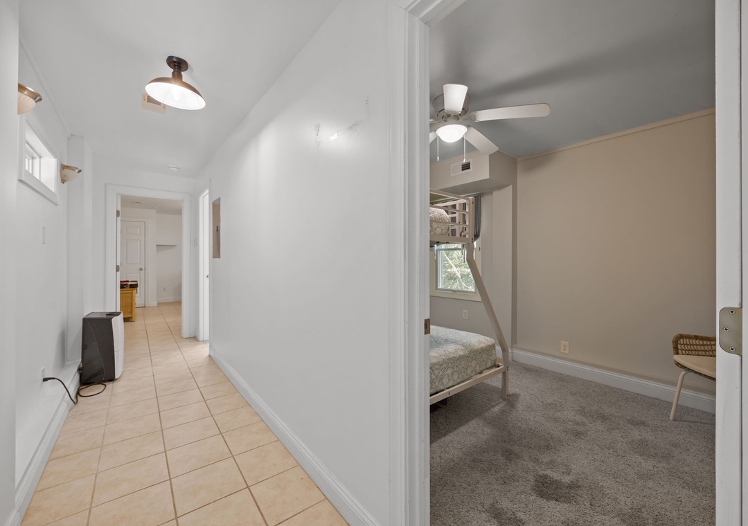 Rest peacefully in your cozy bedroom featuring a comfortable bunk bed setup, perfect for family stays or groups sharing memorable moments together.