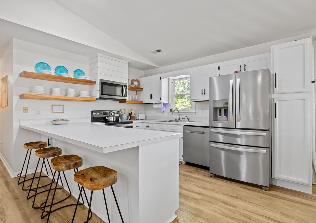 Your fully equipped kitchen features stainless steel appliances, granite countertops, and a breakfast bar where you can start each morning with coffee.