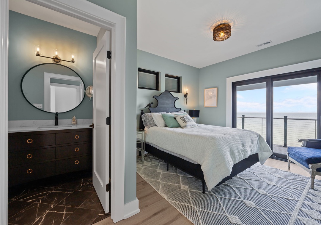 Drift off in this serene bedroom where coastal colors meet modern comfort, your private balcony opening to endless views.