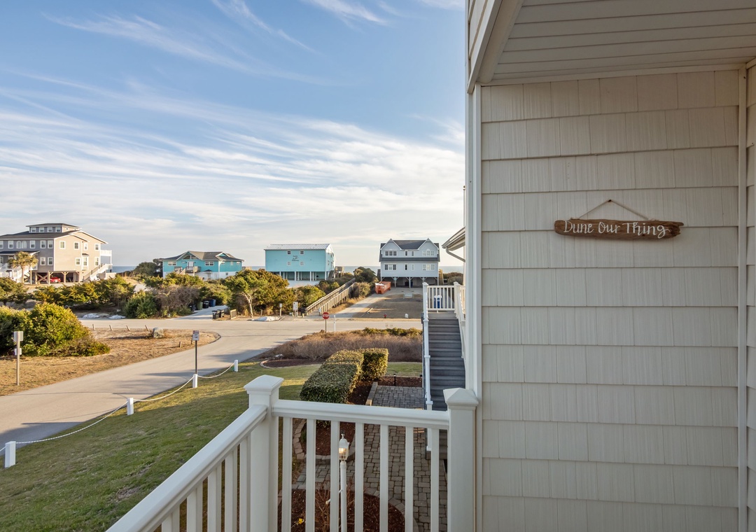 Colorful beach houses dot the coastal landscape with charming neighborhood views from this peaceful retreat.