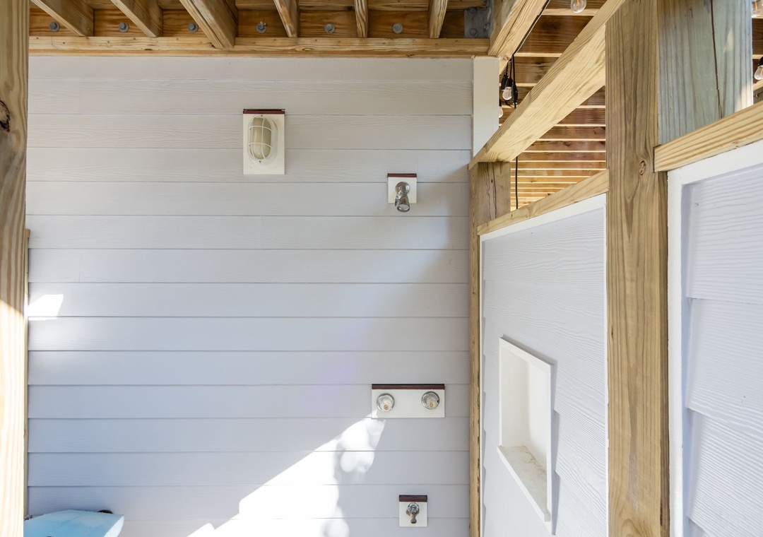 Your private bathroom blends rustic charm with modern comfort, featuring exposed wood beams and crisp white shiplap walls.