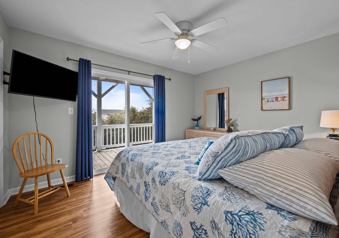 Wake up to gentle breezes from your ceiling fan and peaceful views through French doors leading to your private balcony.