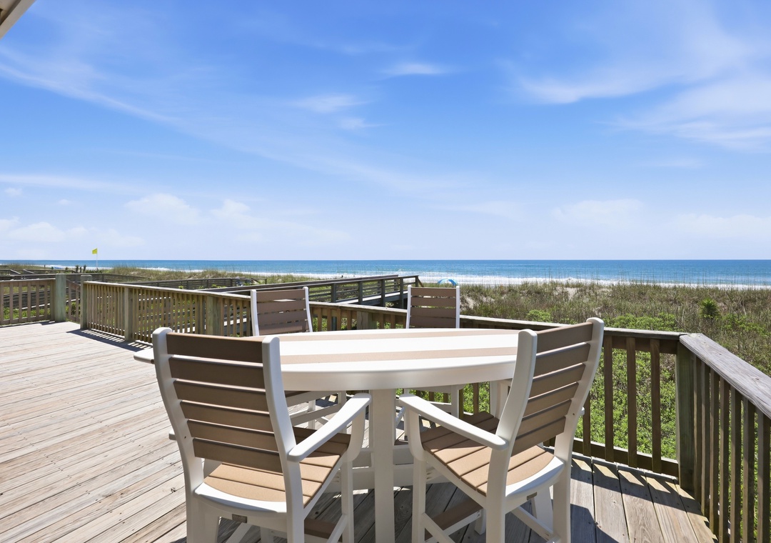 Spacious beachfront deck overlooking pristine white sand and turquoise waters, perfect for morning coffee or sunset dinners with stunning Gulf views.