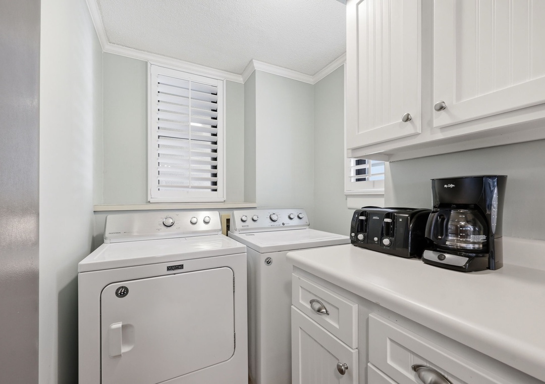 Start your mornings with freshly brewed coffee in this convenient laundry space, complete with a washer and dryer to keep your vacation wardrobe fresh and ready.