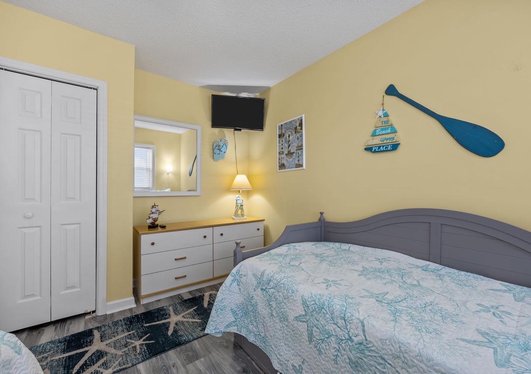 Rest peacefully in your charming coastal-themed bedroom, complete with nautical decor and modern amenities for your perfect beach getaway.