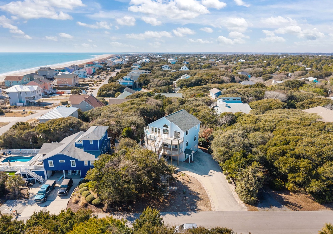 Aerial view showcasing the coastal community setting with beach access and natural surroundings.