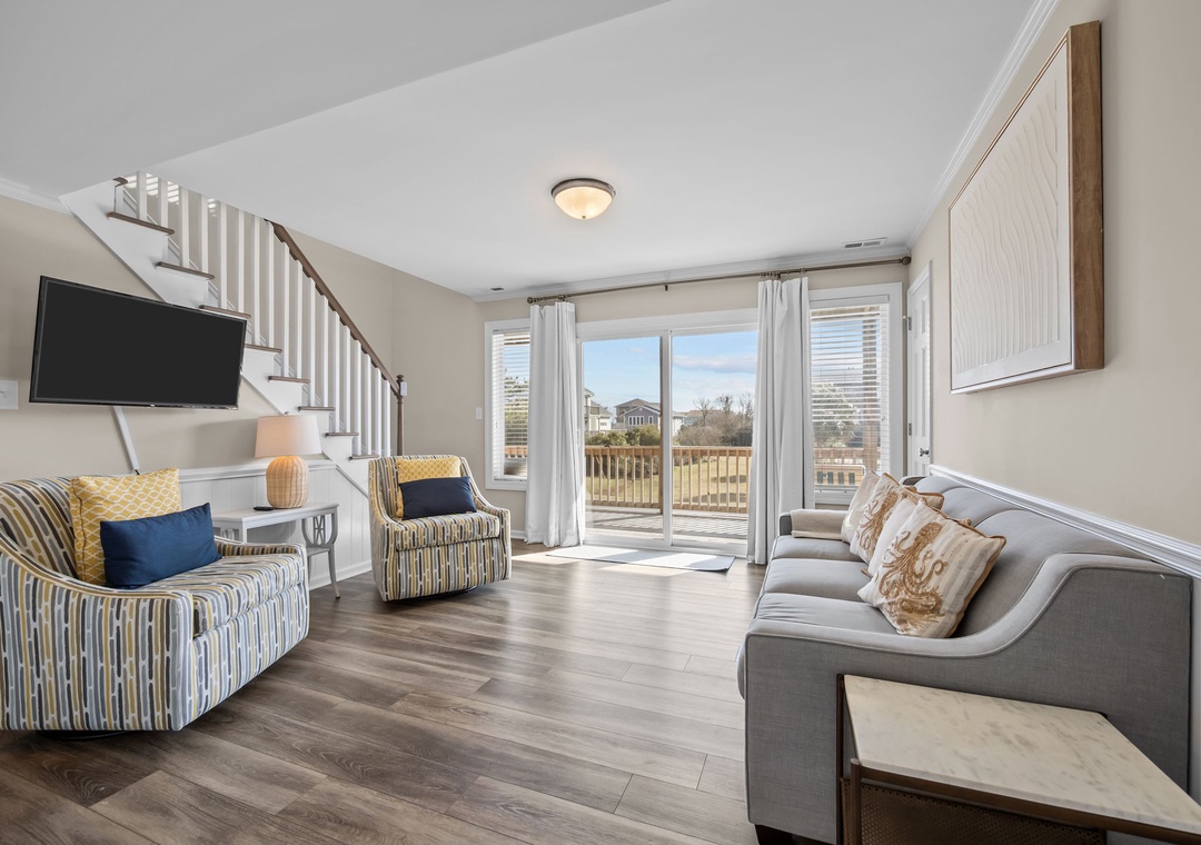 Relax in your bright, airy living space with comfortable seating and sliding doors that open to your private deck.