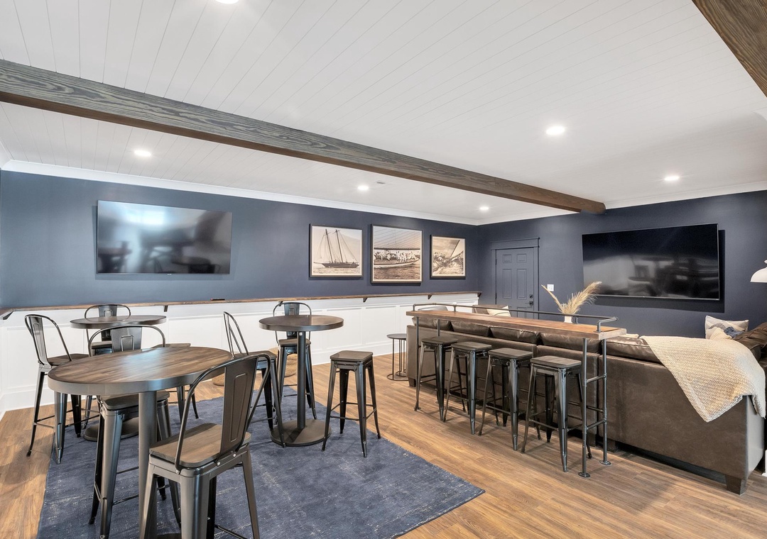 Gather your group in this coastal-themed lounge with stylish seating, dual TVs, and a relaxed vibe perfect for movie nights or friendly conversation.