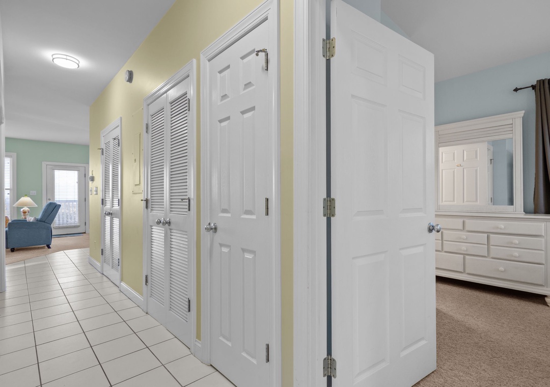 Bright hallway connects your living spaces with convenient storage closets and easy access to every room in your home.