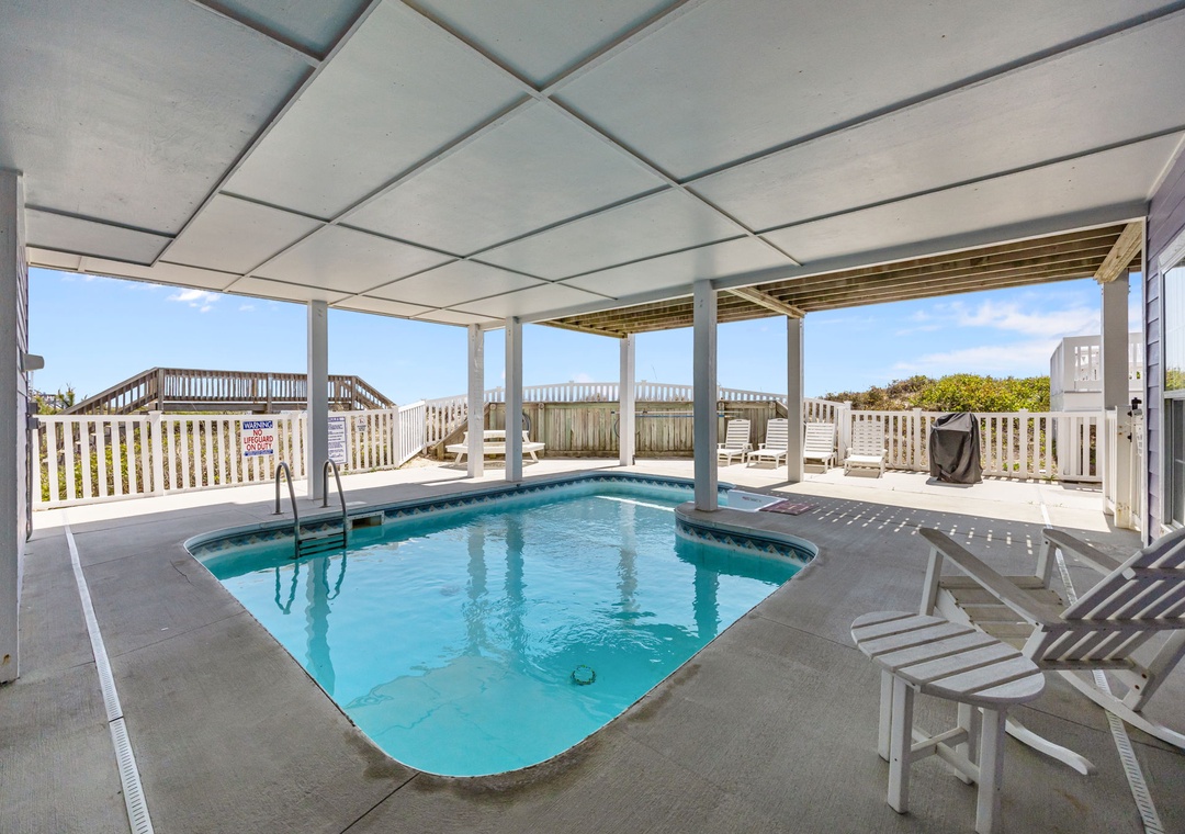 Your private pool oasis awaits with sparkling waters, comfortable lounging chairs, and refreshing ocean breezes from your covered terrace.