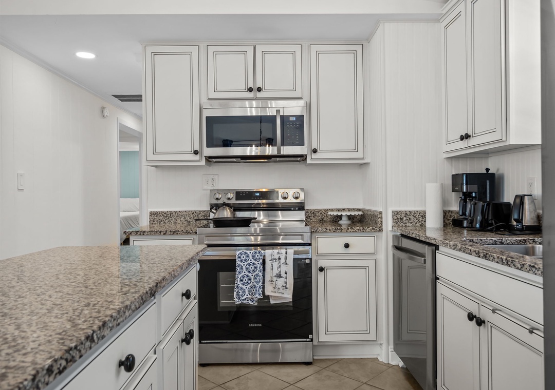 Your fully equipped kitchen awaits with granite countertops, stainless steel appliances, and ample cabinet storage for memorable meal preparations.