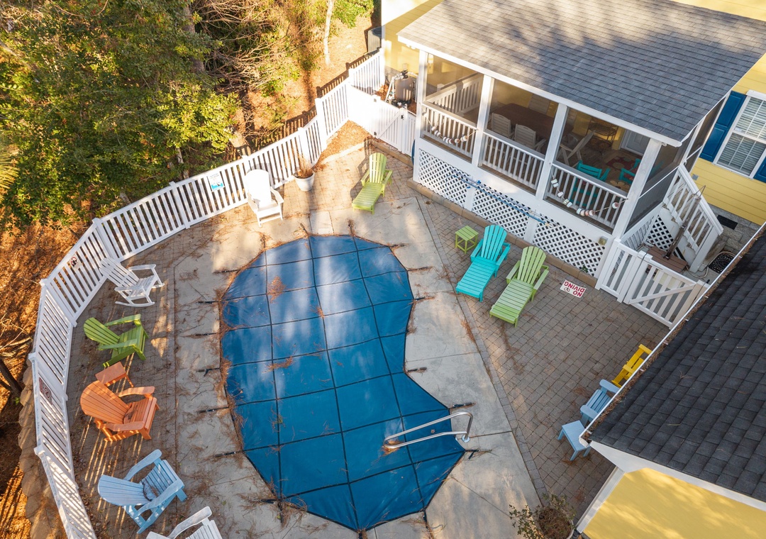 Aerial view showing the vacation rental property with its private swimming pool and covered porch areas.