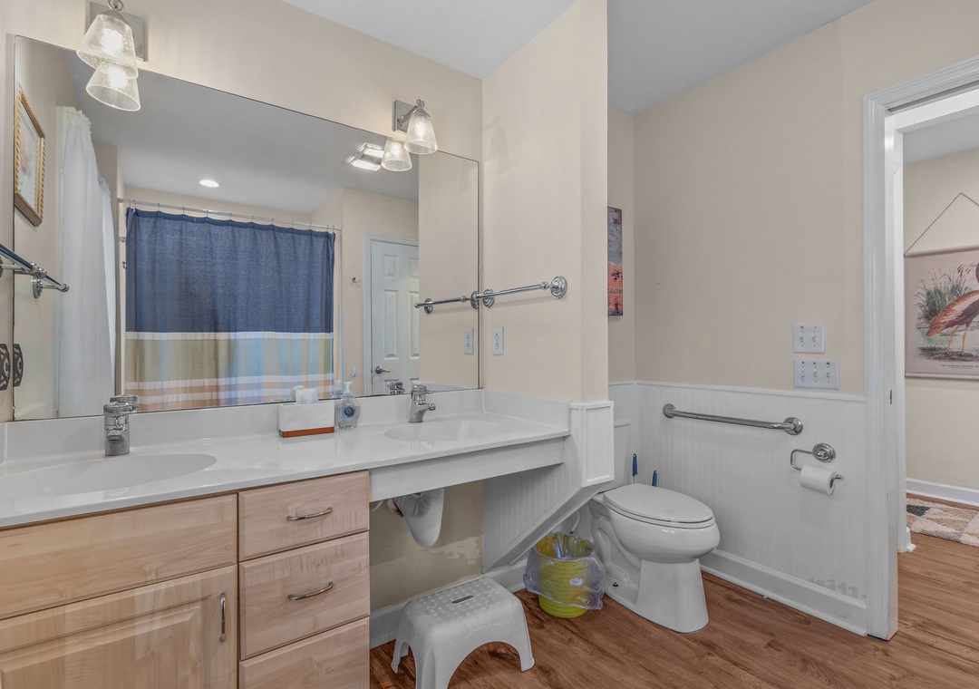 Your spacious bathroom features dual sinks and modern amenities, plus thoughtful accessibility features for everyone's comfort.